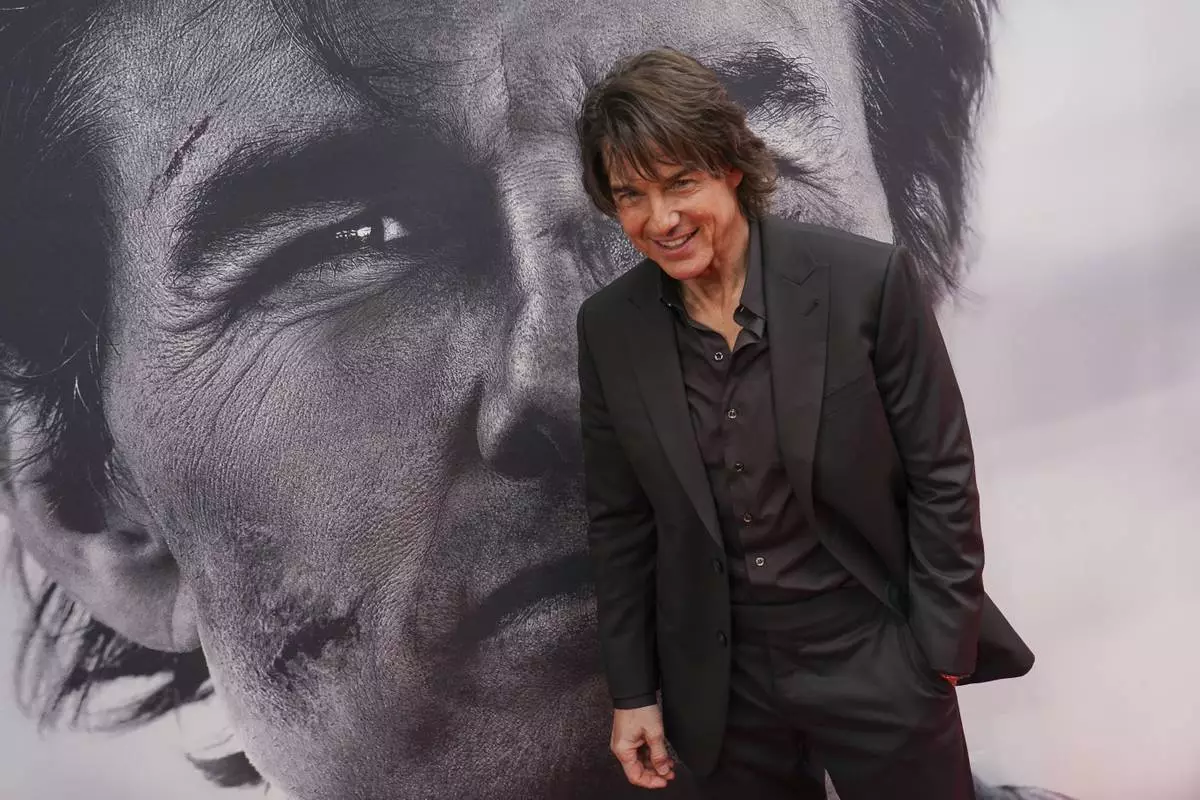 Tom Cruise poses for photographers upon arrival at the premiere of the film 'Mission: Impossible - The Final Reckoning' on Thursday, May 15, 2025, in London. (Photo by Alberto Pezzali/Invision/AP)