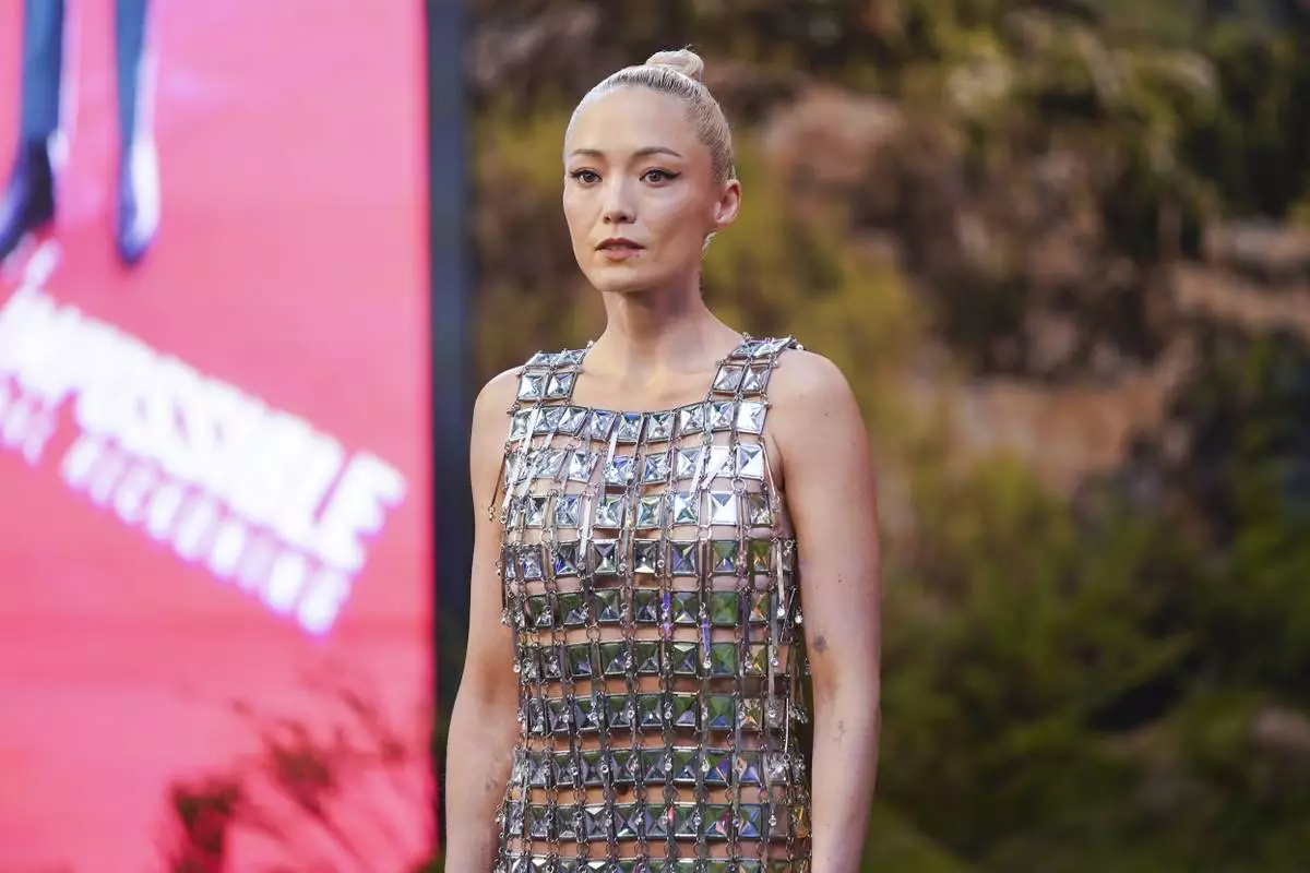 Pom Klementieff poses for photographers upon arrival at the premiere of the film 'Mission: Impossible - The Final Reckoning' on Thursday, May 15, 2025, in London. (Photo by Alberto Pezzali/Invision/AP)