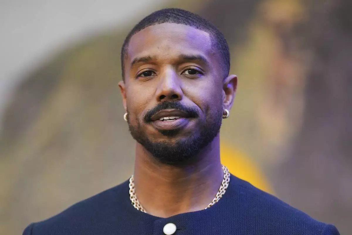 Michael B. Jordan poses for photographers upon arrival at the premiere of the film 'Mission: Impossible - The Final Reckoning' on Thursday, May 15, 2025, in London. (Photo by Alberto Pezzali/Invision/AP)