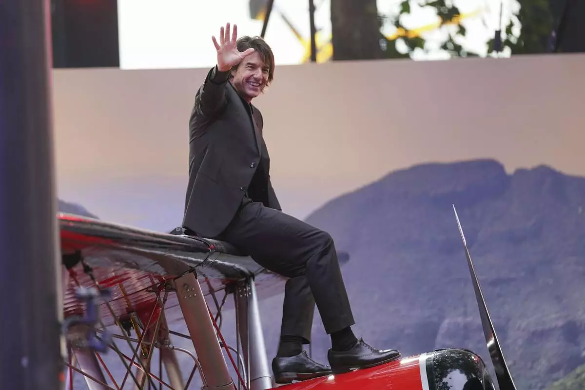 Tom Cruise poses for photographers upon arrival at the premiere of the film 'Mission: Impossible - The Final Reckoning' on Thursday, May 15, 2025, in London. (Photo by Alberto Pezzali/Invision/AP)