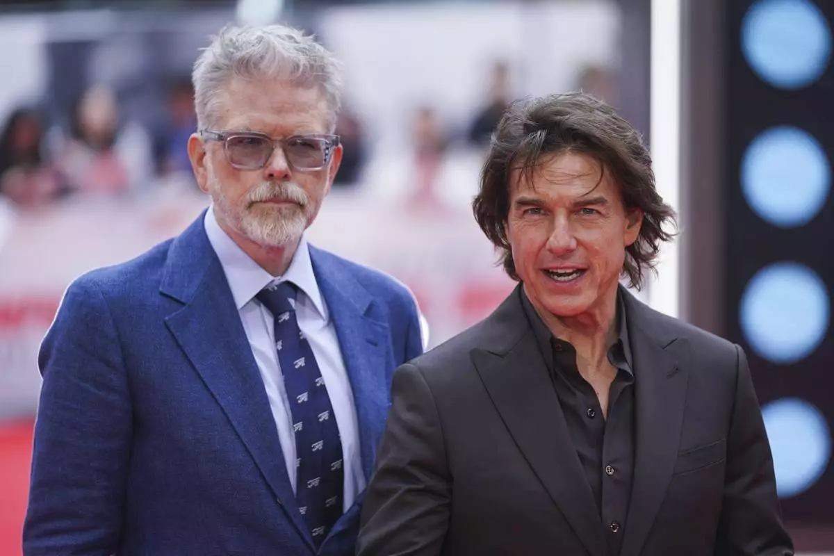 Director Christopher McQuarrie, left, and Tom Cruise pose for photographers upon arrival at the premiere of the film 'Mission: Impossible - The Final Reckoning' on Thursday, May 15, 2025, in London. (Photo by Alberto Pezzali/Invision/AP)