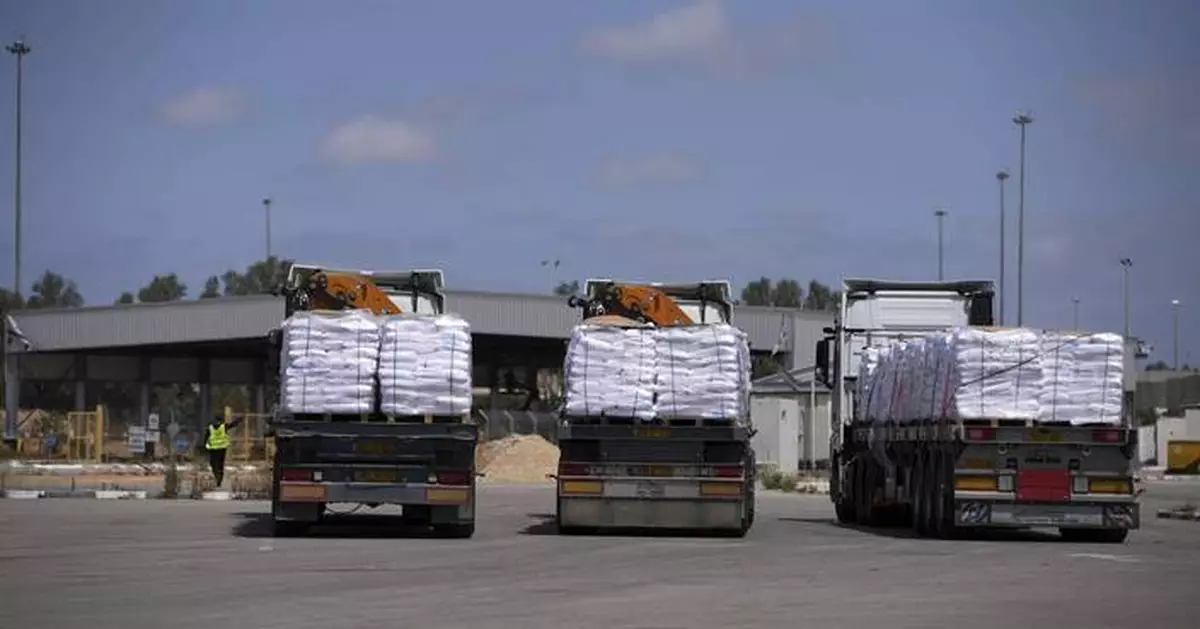 First few aid trucks enter Gaza but allies threaten Israel with sanctions and urge more