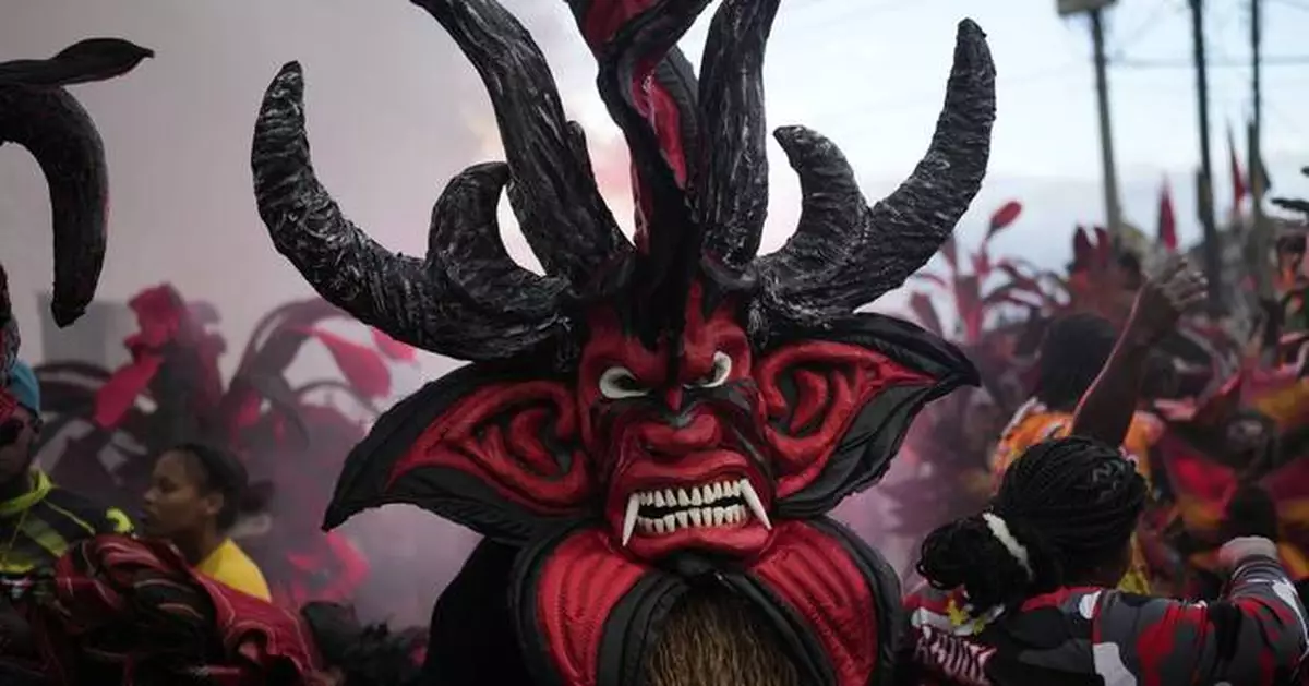 AP PHOTOS: Panama town reckons with dark history of colonialism in Festival of Devils and Congos