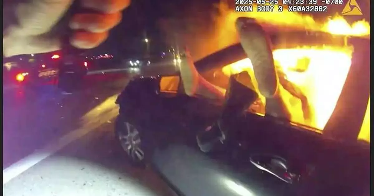 Officer rescues woman from burning car in aftermath of interstate crash in Phoenix