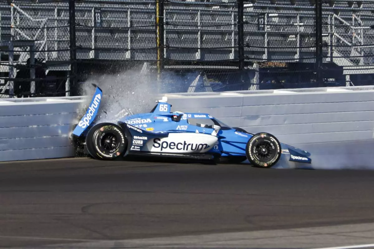 Marcus Armstrong, of New Zealand, hits the wall in the first turn during practice for the Indianapolis 500 auto race at Indianapolis Motor Speedway in Indianapolis, Saturday, May 17, 2025. (AP Photo/Kirk DeBrunner)