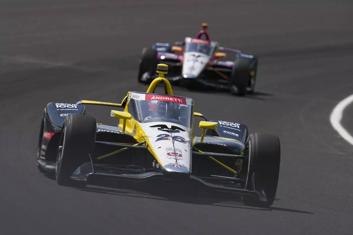 Colton Herta drives through the first turn during practice for the Indianapolis 500 auto race at Indianapolis Motor Speedway in Indianapolis, Thursday, May 15, 2025. (AP Photo/Michael Conroy)