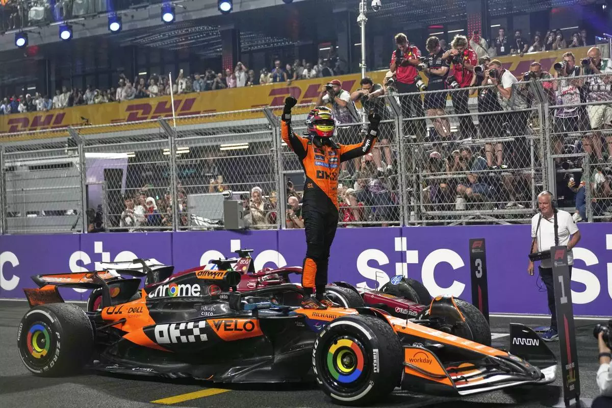 McLaren driver Oscar Piastri of Australia celebrates after winning the Formula One Saudi Arabian Grand Prix at the Jeddah Corniche Circuit in Jeddah, Saudi Arabia, Sunday, April 20, 2025. (AP Photo/Altaf Qadri)