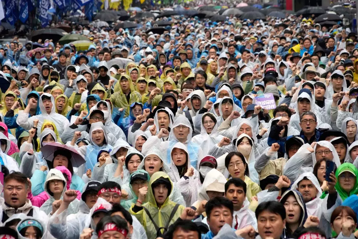 Members of the Korean Confederation of Trade Unions shout slogans during a rally on May Day in Seoul, South Korea, Thursday, May 1, 2025. (AP Photo/Ahn Young-joon)