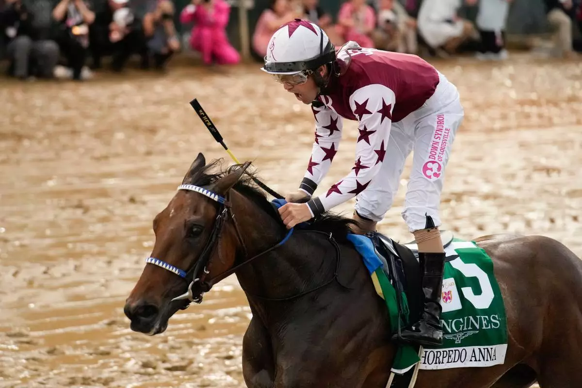 FILE- Jockey Brian Hernandez Jr. reacts aboard Thorpedo Anna after winning the 150th running of Kentucky Oaks horse race at Churchill Downs Friday, May 3, 2024, in Louisville, Ky. (AP Photo/Jeff Roberson, File)