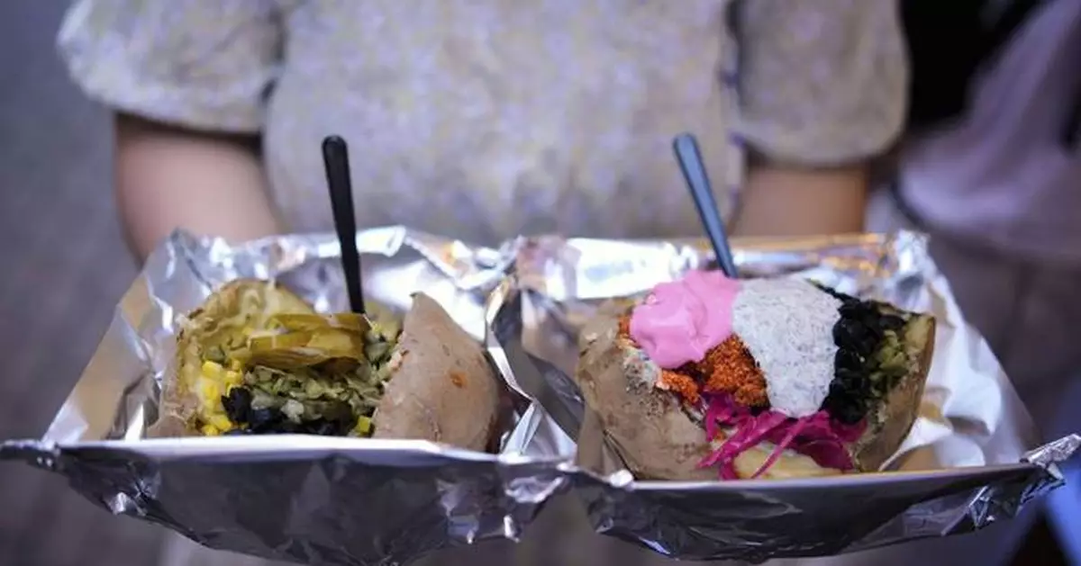 AP PHOTOS: Popular 'kumpir' dish in Turkey is served ahead of International Day of Potato