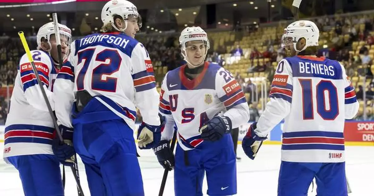 US scores 5 goals in middle period to rout Kazakhstan and advance at ice hockey worlds