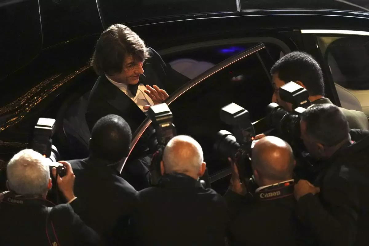 Tom Cruise poses for photographers upon departure from the premiere of the film 'Mission: Impossible – The Final Reckoning' at the 78th international film festival, Cannes, southern France, Wednesday, May 14, 2025. (Photo by Lewis Joly/Invision/AP)