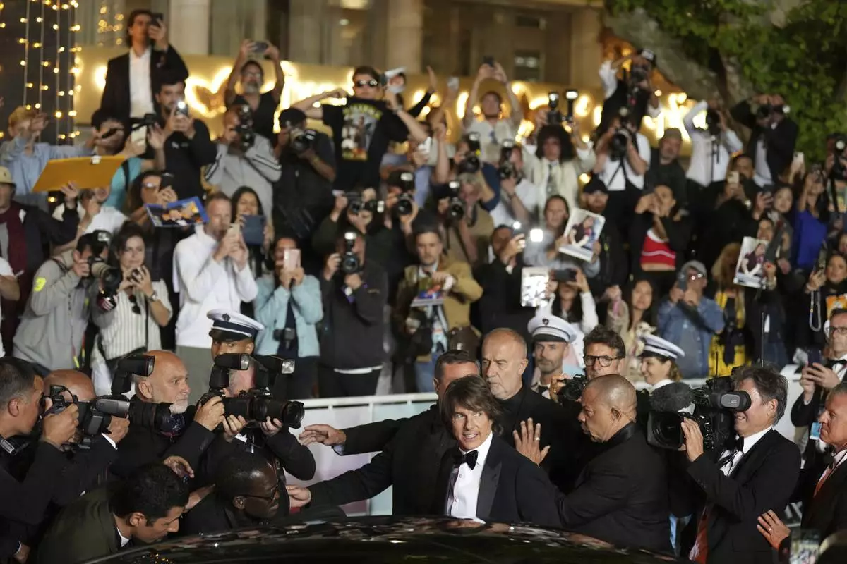 Tom Cruise upon departure from the premiere of the film 'Mission: Impossible – The Final Reckoning' at the 78th international film festival, Cannes, southern France, Wednesday, May 14, 2025. (AP Photo/Natacha Pisarenko)