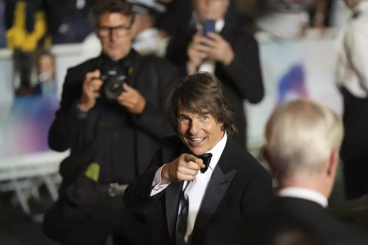 Tom Cruise poses for photographers upon departure from the premiere of the film 'Mission: Impossible – The Final Reckoning' at the 78th international film festival, Cannes, southern France, Wednesday, May 14, 2025. (AP Photo/Natacha Pisarenko)