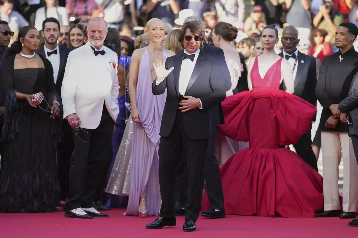 Angela Bassett, from left, writer Erik Jendresen, Pom Klementieff, Tom Cruise, Hayley Atwell, and Greg Tarzan Davis pose for photographers upon arrival at the premiere of the film 'Mission: Impossible - The Final Reckoning' at the 78th international film festival, Cannes, southern France, Wednesday, May 14, 2025. (AP Photo/Natacha Pisarenko)