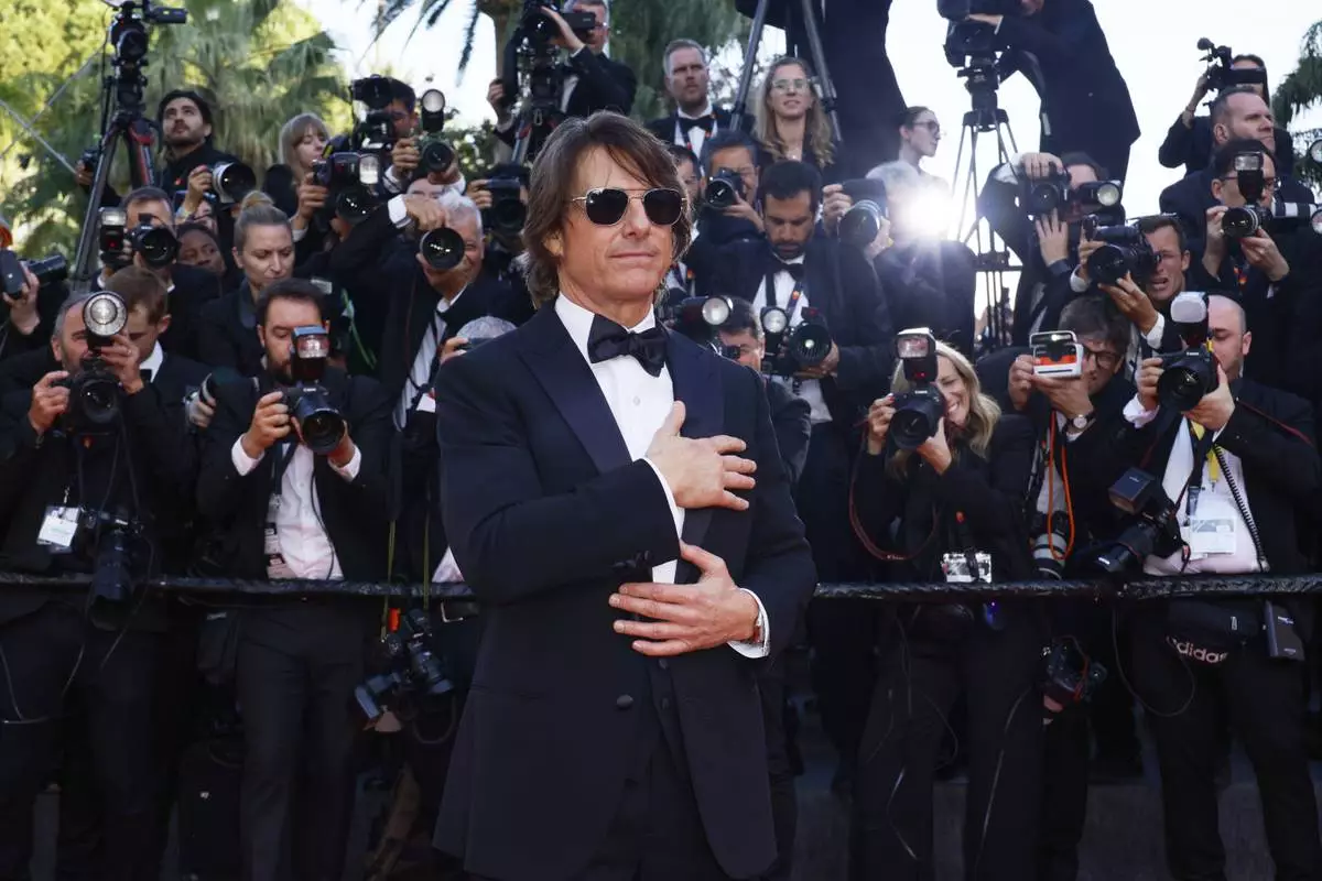 Tom Cruise poses for photographers upon arrival at the premiere of the film 'Mission: Impossible - The Final Reckoning' at the 78th international film festival, Cannes, southern France, Wednesday, May 14, 2025. (Photo by Joel C Ryan/Invision/AP)