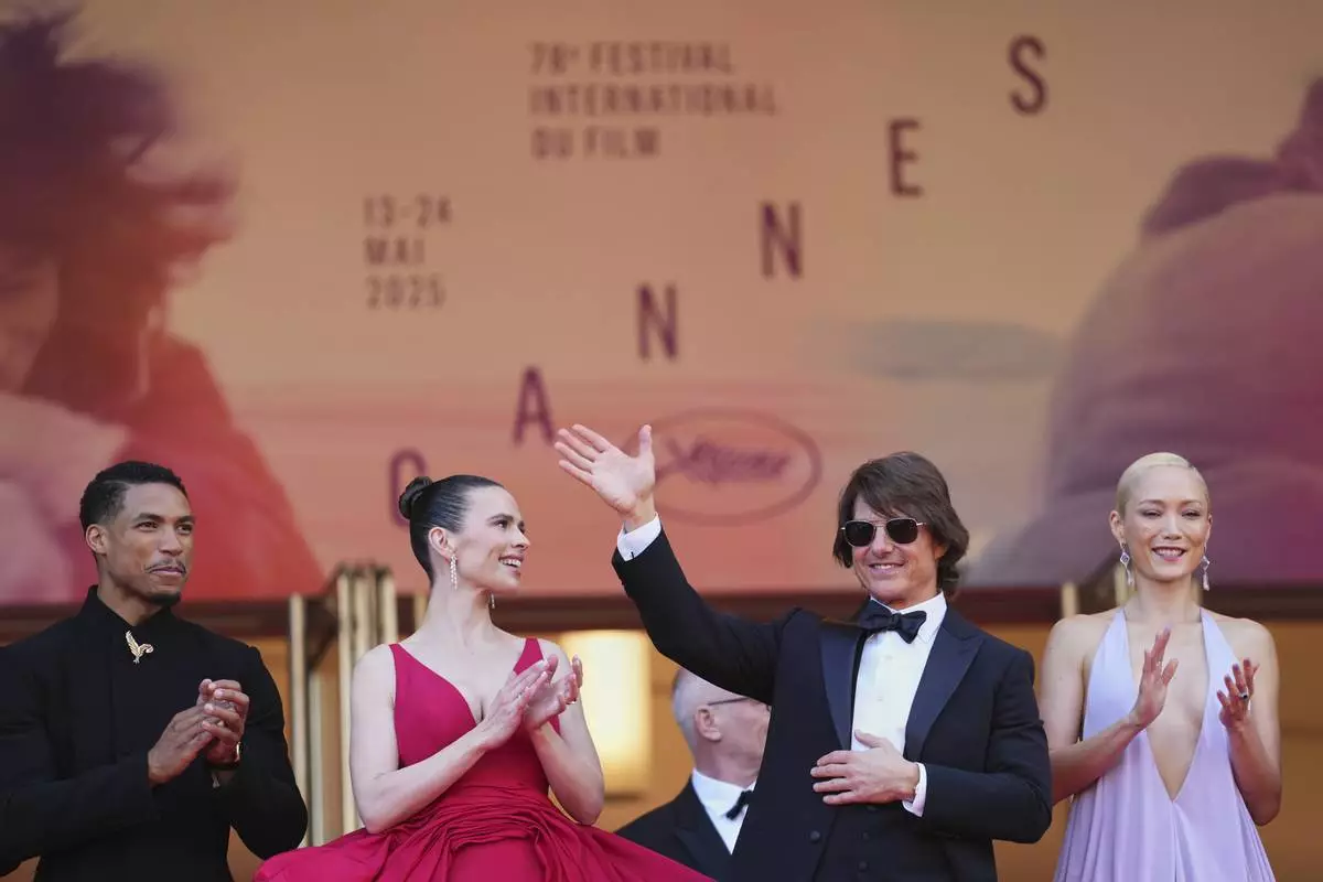 Greg Tarzan Davis, from left, Hayley Atwell, Tom Cruise, and Pom Klementieff pose for photographers upon arrival at the premiere of the film 'Mission: Impossible - The Final Reckoning' at the 78th international film festival, Cannes, southern France, Wednesday, May 14, 2025. (Photo by Scott A Garfitt/Invision/AP)