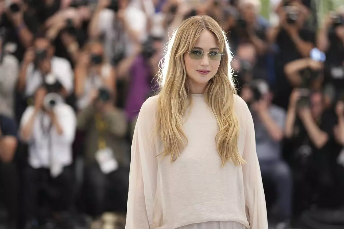 Jennifer Lawrence poses for photographers at the photo call for the film 'Die, My Love' at the 78th international film festival, Cannes, southern France, Sunday, May 18, 2025. (Photo by Scott A Garfitt/Invision/AP)
