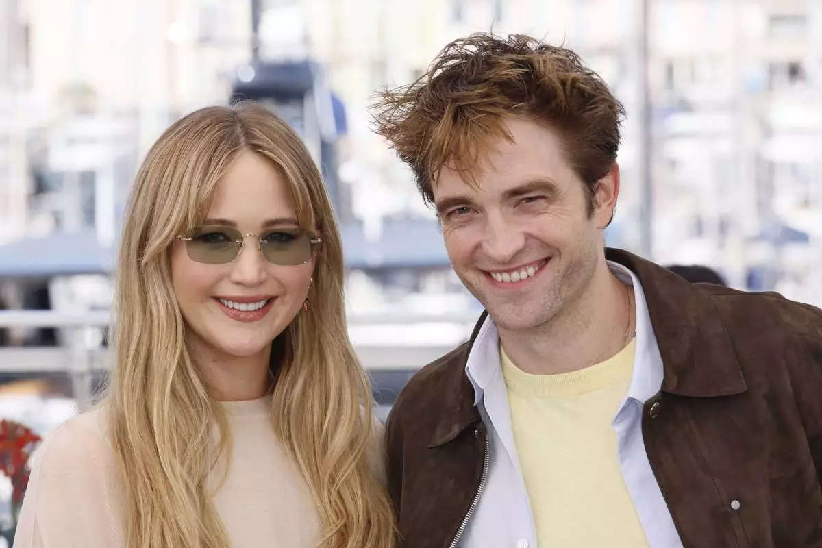 Jennifer Lawrence, left, and Robert Pattinson pose for photographers at the photo call for the film 'Die, My Love' at the 78th international film festival, Cannes, southern France, Sunday, May 18, 2025. (Photo by Joel C Ryan/Invision/AP)