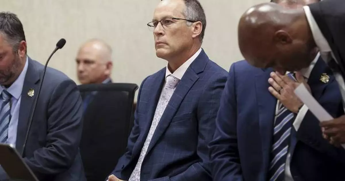 Judge throws out murder charge against Michigan officer who struck a fleeing man