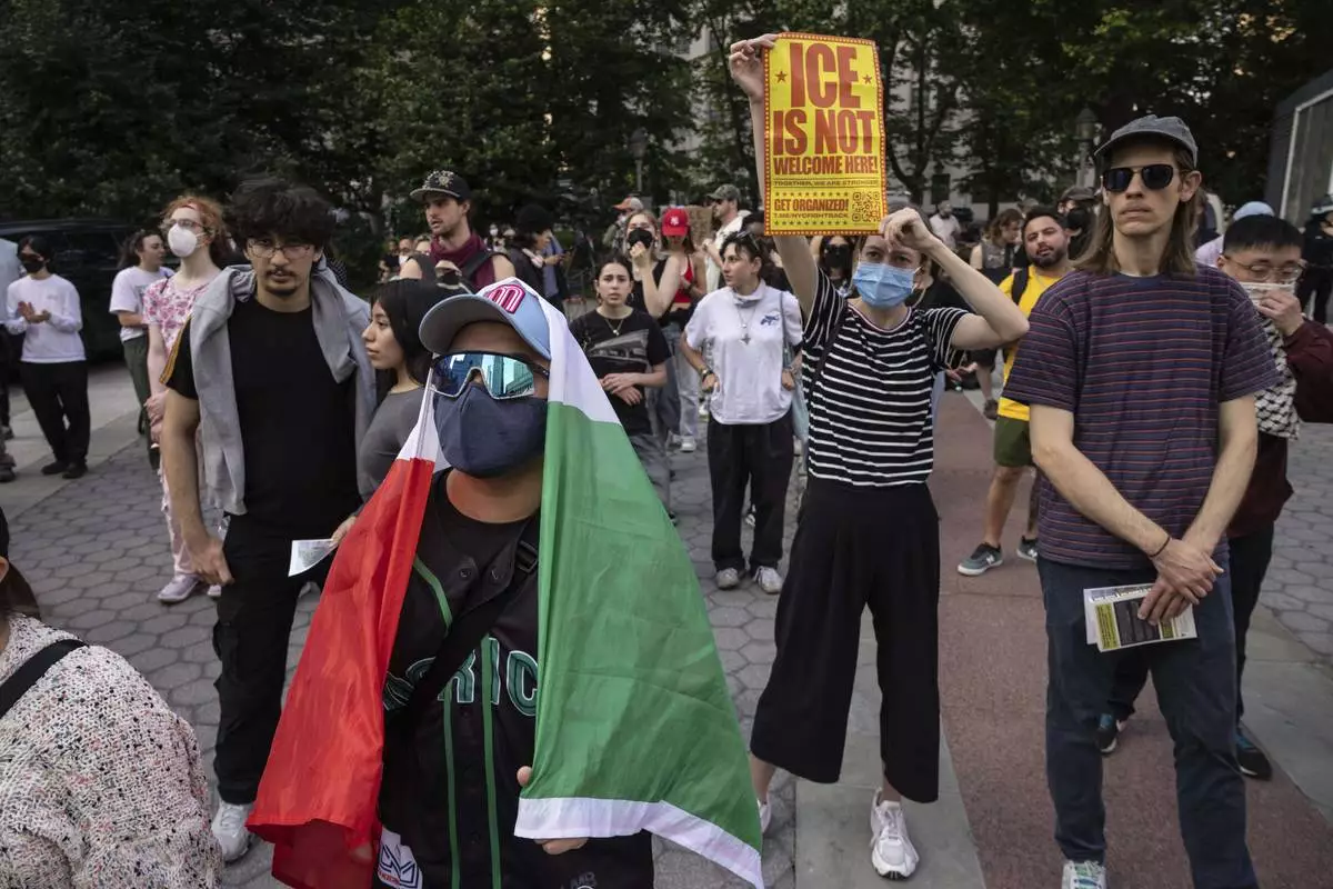 A demonstrator with carrying a Mexican flag chants during a protest against deportation by Immigration and Customs Enforcement in New York, Wednesday, June 11, 2025. (AP Photo/Yuki Iwamura)