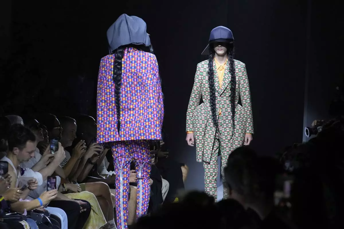 Models wear creations part of the men's Comme des Garcons Homme Plus Spring-Summer 2026 collection, that was presented in Paris Friday, June 27, 2025. (AP Photo/Michel Euler)