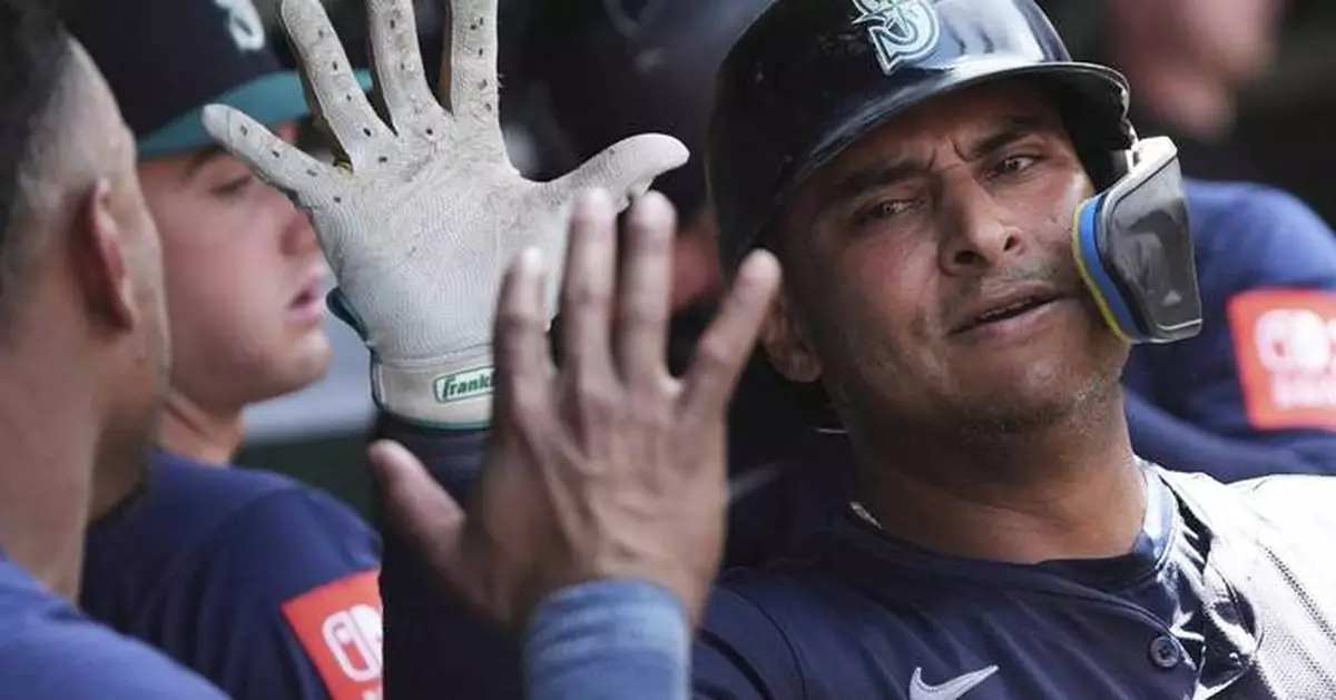 Donovan Solano hits 2 homers as the Seattle Mariners beat the Chicago Cubs 14-6