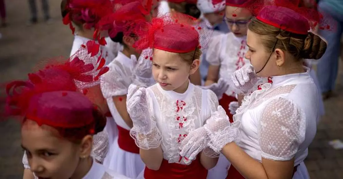 AP PHOTOS: Romanian children celebrate International Children’s Day at the Palace of Parliament