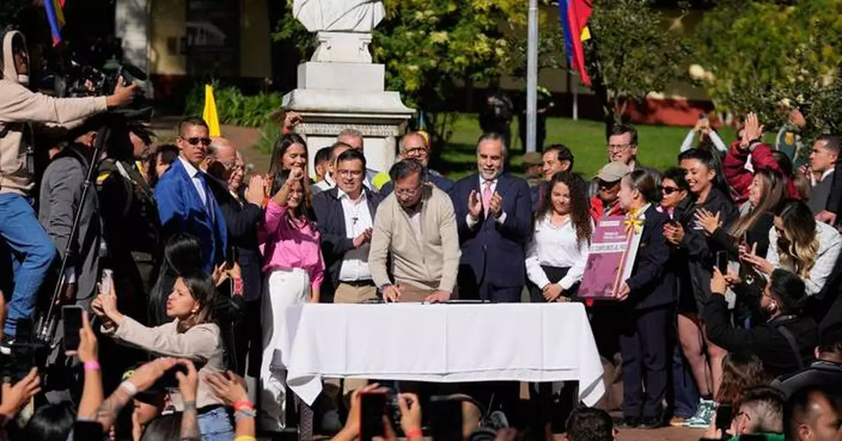 Colombia's president signs a labor overhaul into law after 2 failed attempts