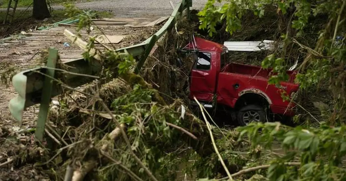 Flash flooding again hits West Virginia communities still trying to clean up from deadly deluge