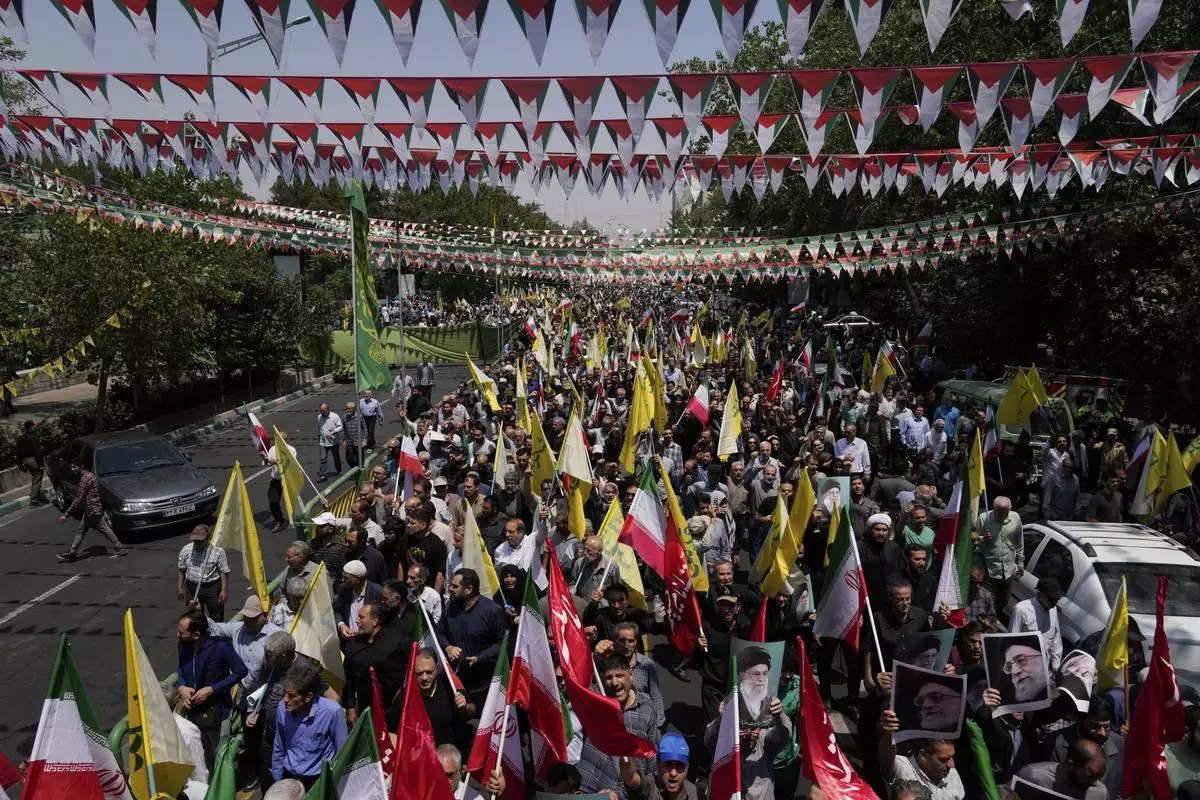 Iranian worshippers attend an anti-Israeli rally after their Friday prayers in Tehran, Iran, Friday, June 13, 2025. (AP Photo/Vahid Salemi)