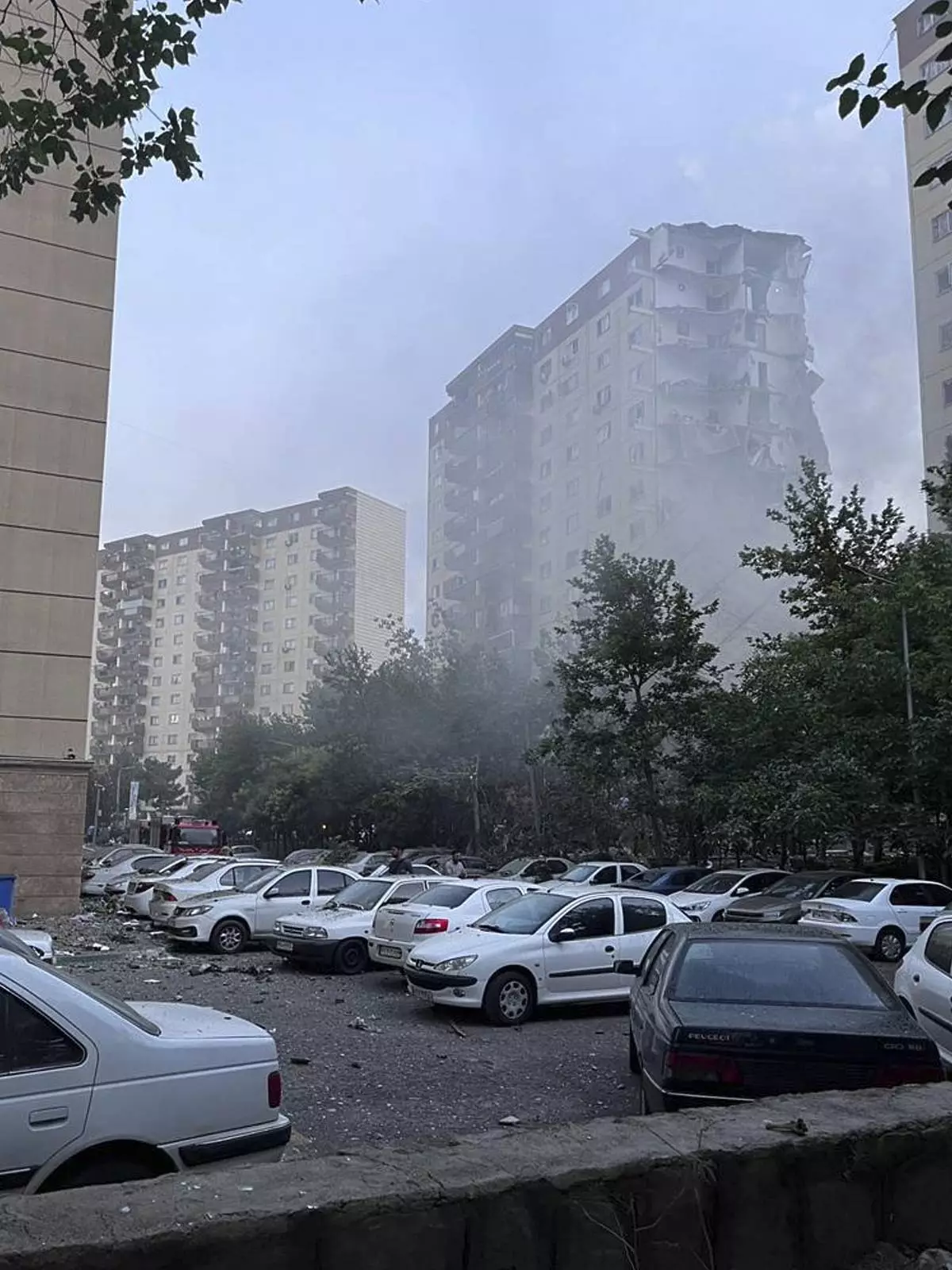 Smoke rises from a damaged building in Tehran, Iran, early Friday, June 13, 2025. Israel attacked Iran's capital early Friday, with explosions booming across Tehran. (AP Photo)