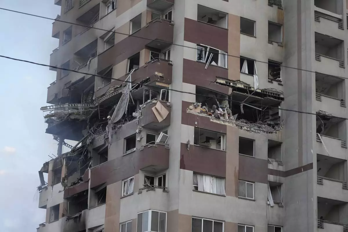 Damage is seen to an apartment building after Israeli attacks in Tehran, Friday, June 13, 2025. (AP Photo/Vahid Salemi)