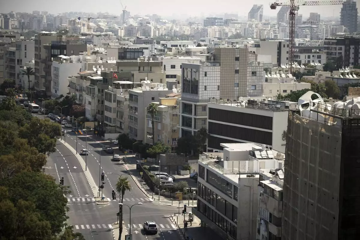 A general view shows the mostly empty streets near Tel Aviv's beachfront, Friday, June 13, 2025. (AP Photo/Leo Correa)