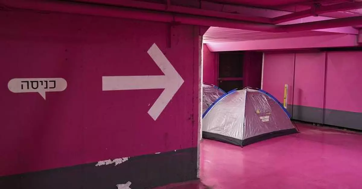 Photos of Israel's underground parking lots and subways being used as bomb shelters during war