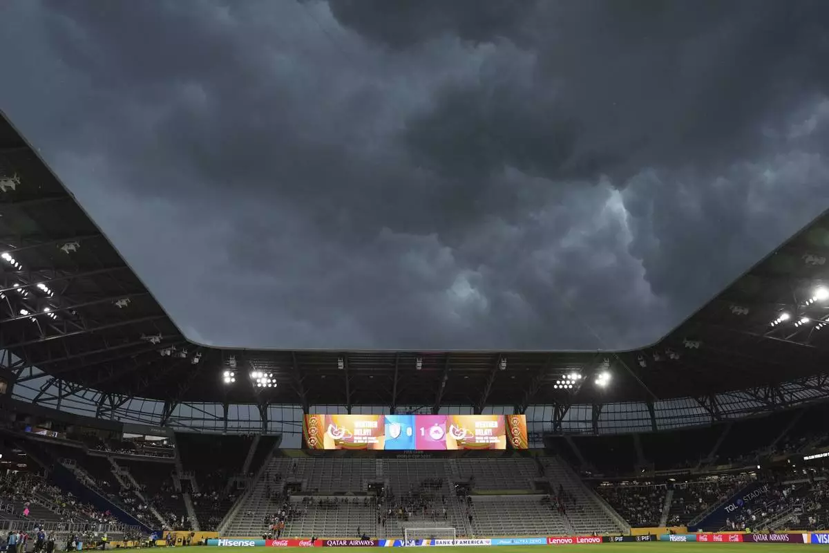 Storms clouds move over the stadium during the Club World Cup group H soccer match between CF Pachuca and FC Salzburg in Cincinnati, Wednesday, June 18, 2025. (AP Photo/Joshua A. Bickel)