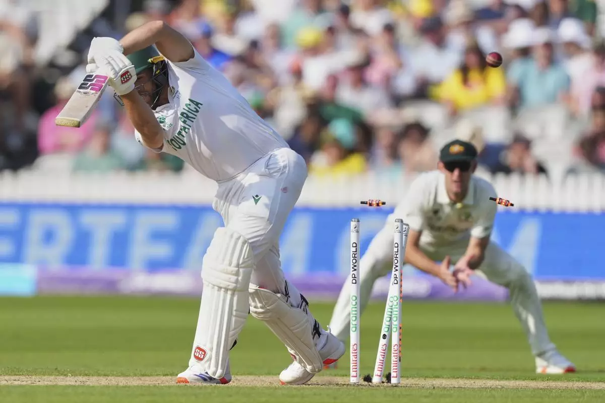 South Africa's Wiaan Mulder is bowled out by Australia's captain Pat Cummins during the World Test Championship final between South Africa and Australia at Lord's cricket ground in London, Wednesday, June 11, 2025. (AP Photo/Kirsty Wigglesworth)