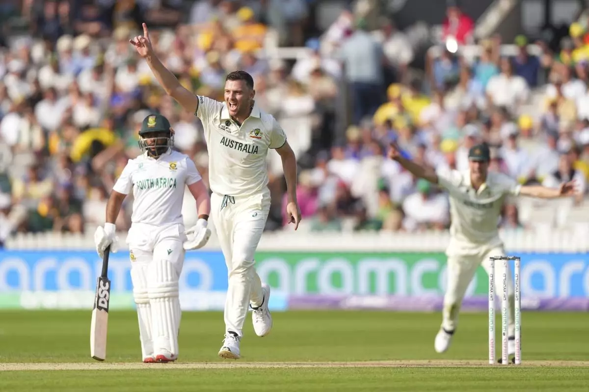 Australia's Josh Hazlewood, center, celebrates the dismissal of South Africa's Tristan Stubbs during the World Test Championship final between South Africa and Australia at Lord's cricket ground in London, Wednesday, June 11, 2025. (AP Photo/Kirsty Wigglesworth)