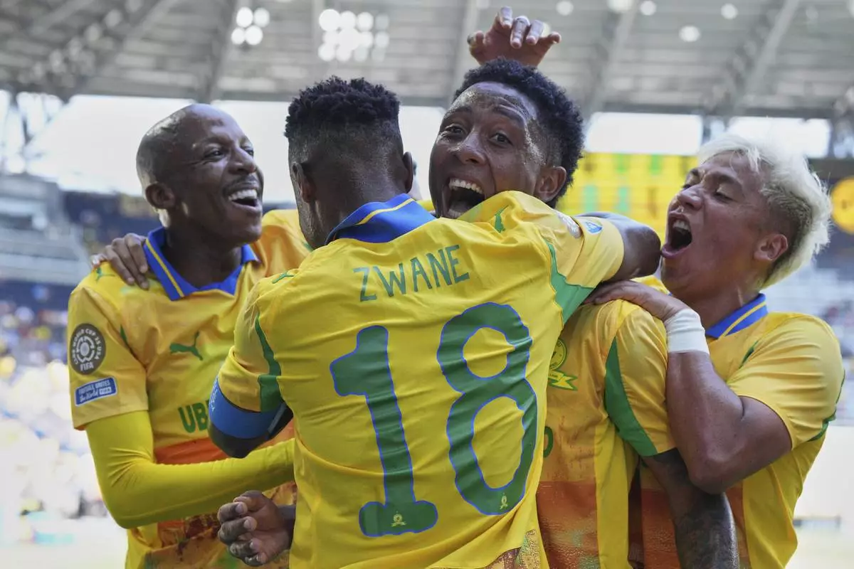 Mamelodi Sundowns celebrate after scoring opening goal during the Club World Cup Group F soccer match between Mamelodi Sundowns and Borussia Dortmund in Cincinnati, Saturday, June 21, 2025. (AP Photo/Jeff Dean)