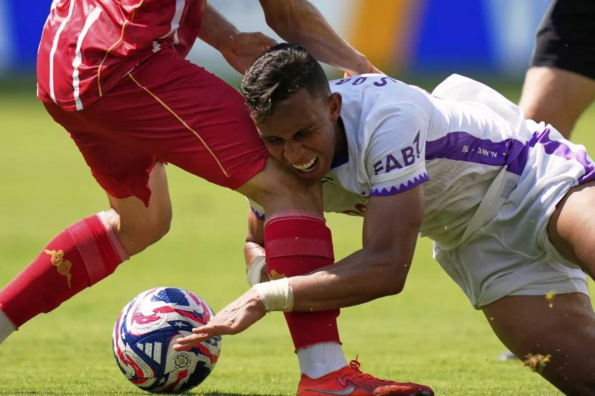 Al Ain's Soufiane Rahimi runs into Wydad AC's Oussama Zemraoui during the Club World Cup Group G soccer match between Wydad AC and Al Ain FC in Washington, Thursday, June 26, 2025. (AP Photo/Julia Demaree Nikhinson)