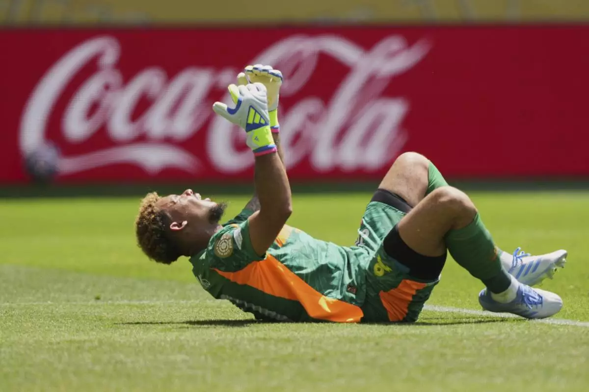 Mamelodi Sundowns goalkeeper Ronwen Williams (30) reacts after he gave the ball away for a goal Borussia Dortmund's Felix Nmecha during the Club World Cup Group F soccer match between Mamelodi Sundowns and Borussia Dortmund in Cincinnati, Saturday, June 21, 2025. (AP Photo/Carolyn Kaster)