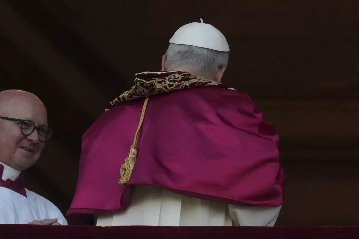 FILE - Newly elected Pope Leo XIV leaves after appearing on the balcony of St. Peter's Basilica at the Vatican, May 8, 2025. (AP Photo/Andrew Medichini, File)