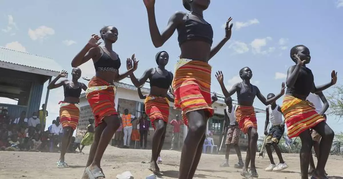 Fusion between culture and modernity as children dance in Kenyan refugee camp