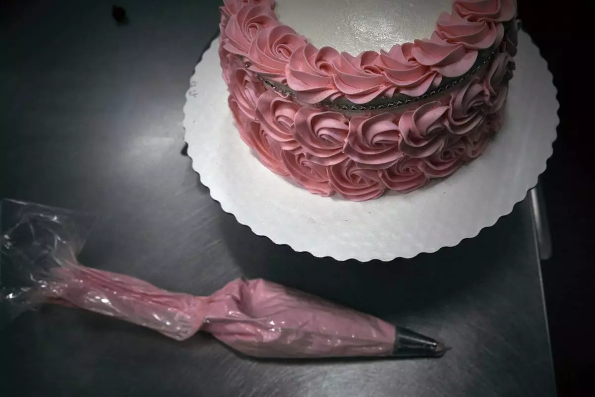 A piping bag lays next to a cake inside Walmart Supercenter on Wednesday, May 28, 2025, in North Bergen, N.J. (AP Photo/Andres Kudacki)
