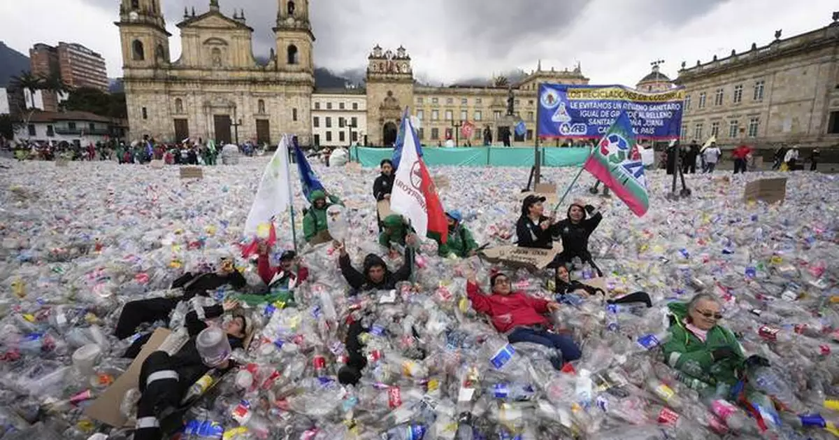 Colombian waste pickers inundate iconic Bogota square with plastic bottles to protest falling wages