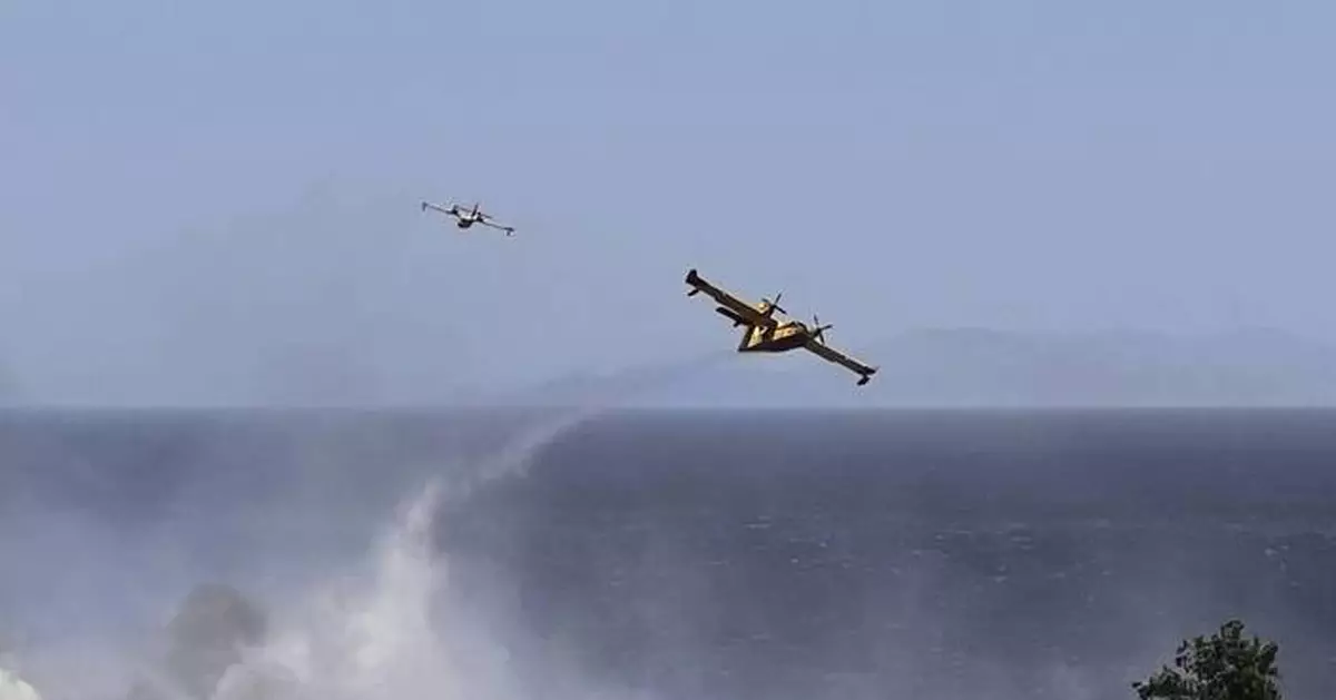 Wildfire prompts evacuations near Athens as summer's first heat wave hits Greece