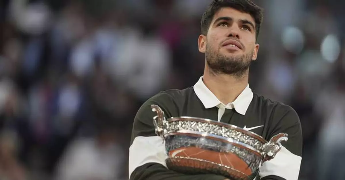 AP PHOTOS: Alcaraz beats Sinner in stunning comeback in French Open final