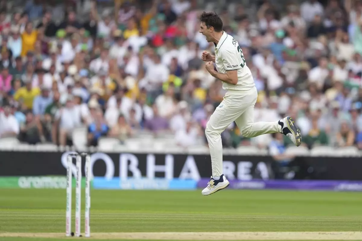 Australia's captain Pat Cummins celebrates the dismissal of South Africa's captain Temba Bavuma on day two of the World Test Championship final between South Africa and Australia at Lord's cricket ground in London, Thursday, June 12, 2025. (AP Photo/Kirsty Wigglesworth)