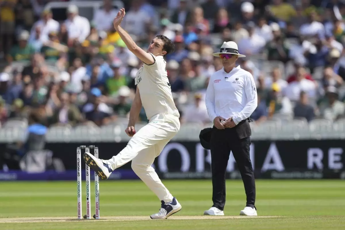 Australia's captain Pat Cummins bowls a delivery on day four of the World Test Championship final between South Africa and Australia at Lord's cricket ground in London, Saturday, June 14, 2025. (AP Photo/Kirsty Wigglesworth)