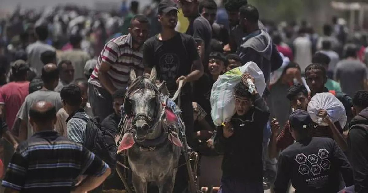 Palestinians say Israel and its allies fired on a crowd near Gaza aid site. Hospital says 14 killed